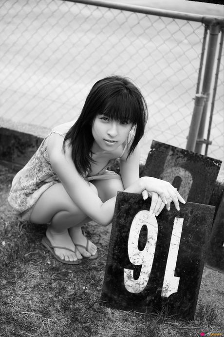 Asian teen Kasumi Nakane displays her natural small tits and disrobes for the camera in nature