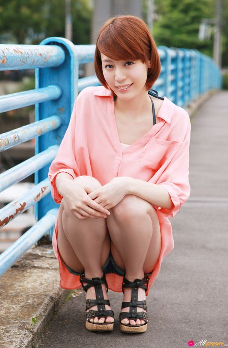 Asian babe Erika Tsunashima displays her tiny boobs and her shaved pussy