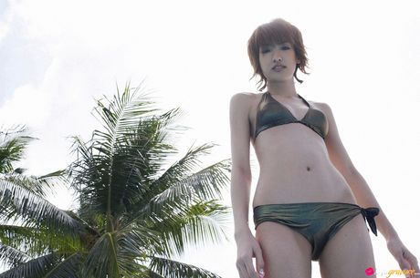 Asian teen Akina Minami gets naked in a pool before a nude modelling gig