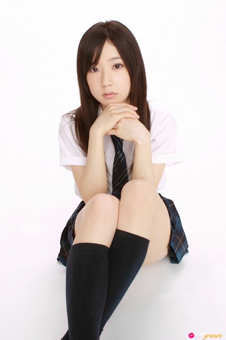 Asian teen Mika Nai shows her natural small tits and poses in a school uniform