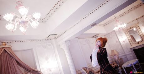 Asian stunner Saku wears a black dress before getting naked on a sofa