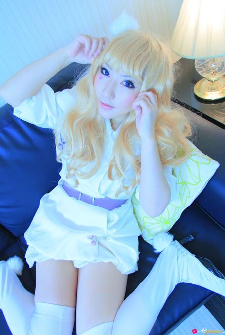 Light-Haired japanese girl Saku wears white stockings while modelling in a dress