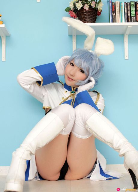 Asian bunny Saku displays her petite tits and poses in white stockings