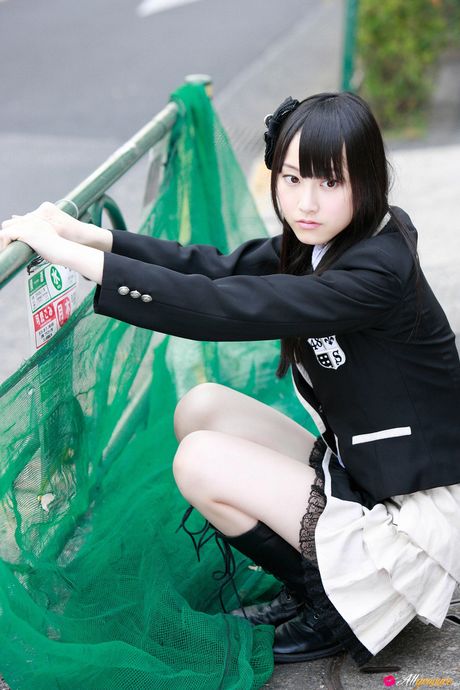 Dark haired teen Rena Matsui gets naked on a bicycle in a school uniform