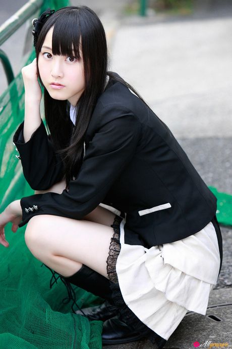 Dark haired teen Rena Matsui gets naked on a bicycle in a school uniform