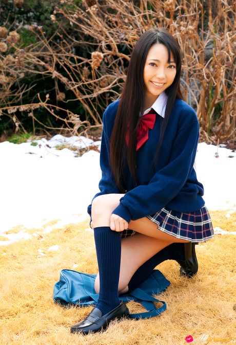 Asian covergirl Ai Nomura gets undressed on a bed in knee socks