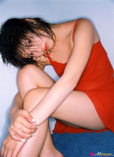 Asian teen Anna Sakaki gets naked in a poolside setting