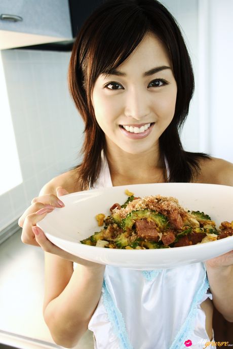 Babe with a slim body Minase Yashiro poses in a solo in a bedroom