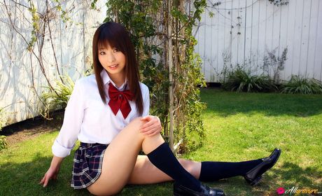 Asian teen Kei Suzukawa displays her tiny tits and poses in a solo