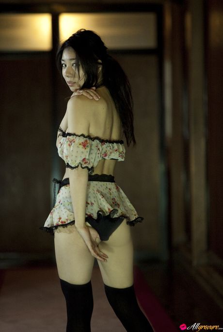 Asian beauty Yume Sato exposes her small tits and poses in stockings