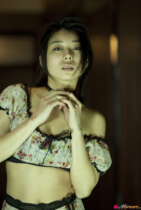 Asian beauty Yume Sato exposes her small tits and poses in stockings