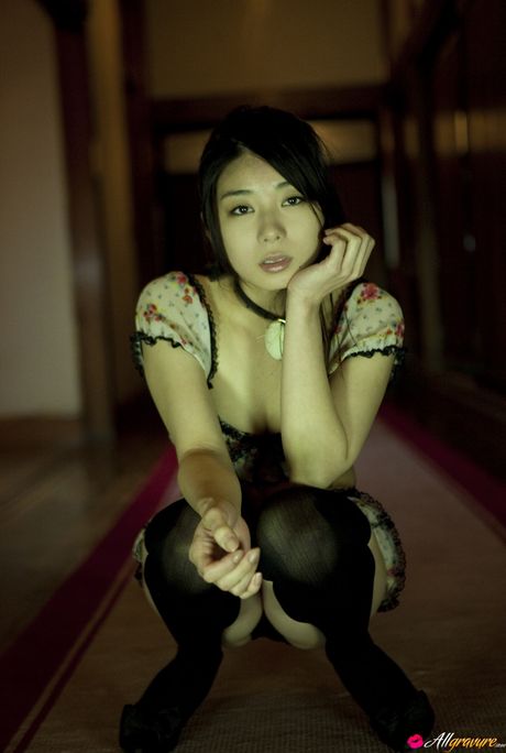 Asian beauty Yume Sato exposes her small tits and poses in stockings