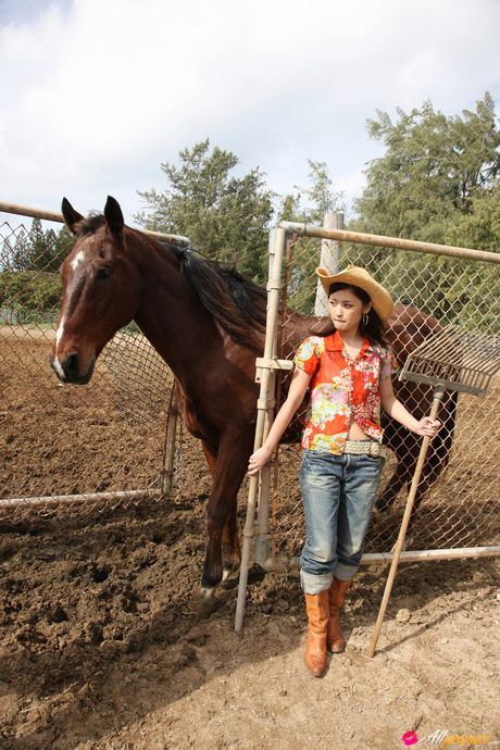 Asian teen Rika Ishikawa gets naked in a cowboy hat and boots
