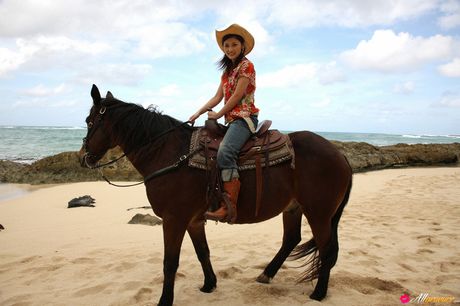 Asian teen Rika Ishikawa gets naked in a cowboy hat and boots