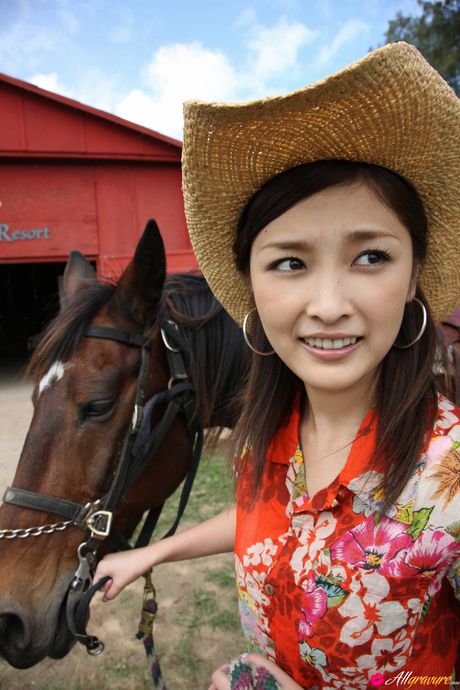 Asian teen Rika Ishikawa gets naked in a cowboy hat and boots