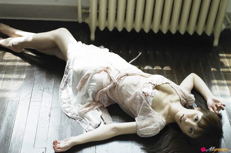 Asian teen Yuki Morisaki slips off her dress before getting naked in a bedroom