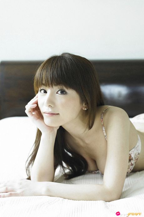 Asian teen Yuki Morisaki slips off her dress before getting naked in a bedroom