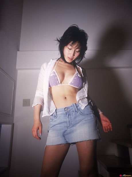 Asian doll Hiroko Sato shows her big tits and poses in a solo