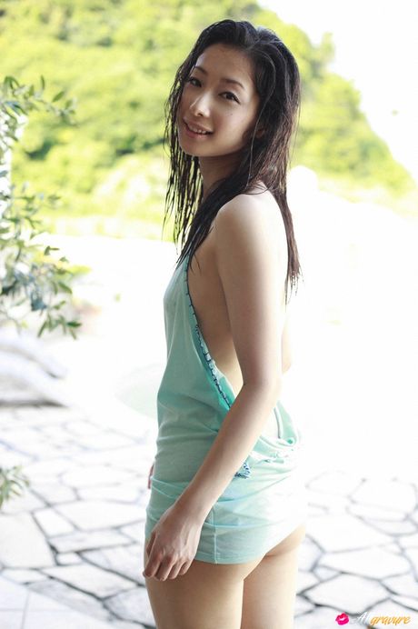 Black hair beauty Eri demonstrates her natural tits and bald pussy