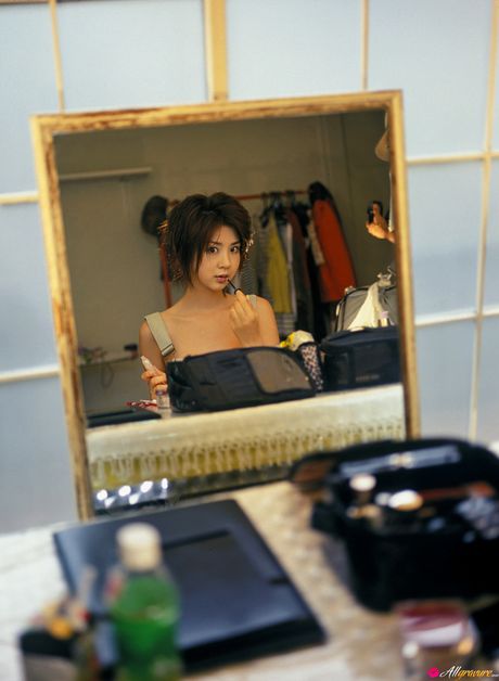 Asian girl Aki Hoshino gets naked on a kitchen counter