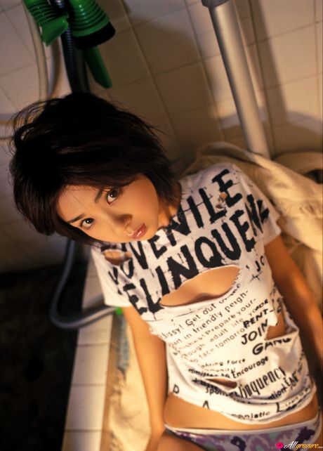 Asian girl Aki Hoshino gets naked on a kitchen counter