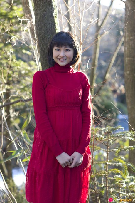Asian girl Wada Ayaka displays her bald pussy while posing in a red coat