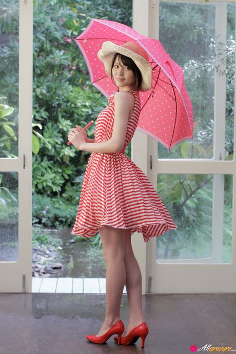 Asian babe Maimi Yajima flaunts her natural small tits and poses in a red umbrella