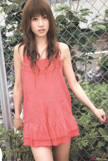 Asian girl Mai Oshima gets naked on a swing set in a garden