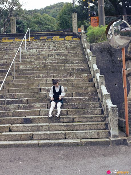 Asian doll Maomi Yuuki shows her nice tits and poses in white stockings