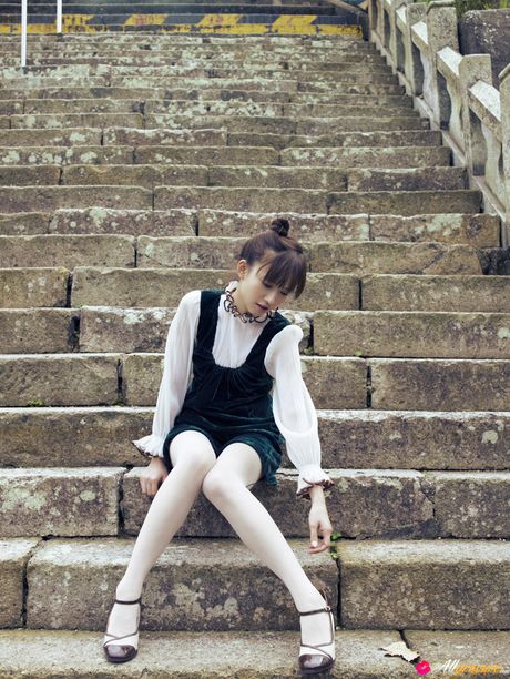 Asian doll Maomi Yuuki shows her nice tits and poses in white stockings