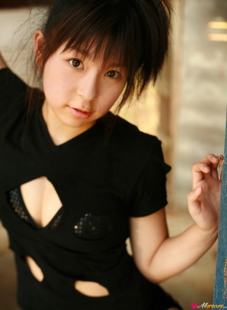 Asian girl Saya Hikita gets naked in a military hat and boots