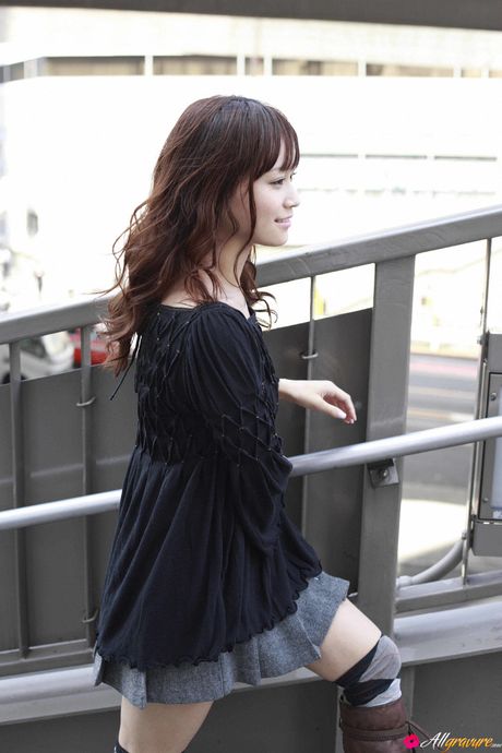 Pretty Asian teen Eri Kamei exhibits her perfect ass and her bald pussy in a solo