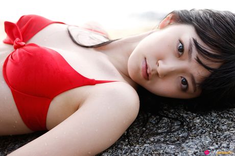 Asian covergirl Airi Suzuki removes her bikini before getting in a pool
