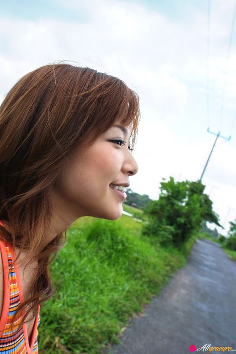 Asian doll Yua Aida gets naked on a blanket in high heels