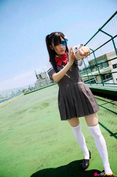 Asian schoolgirl Mayu Watanabe flaunts her nice tits and poses in stockings