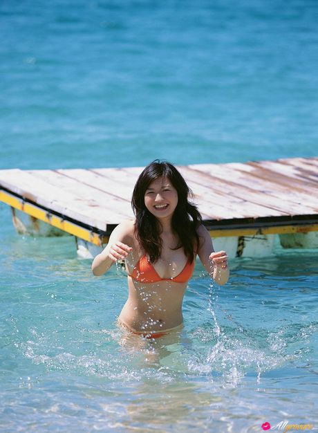 Asian girl Konomi Yoshikawa displays her nice tits and poses in a solo