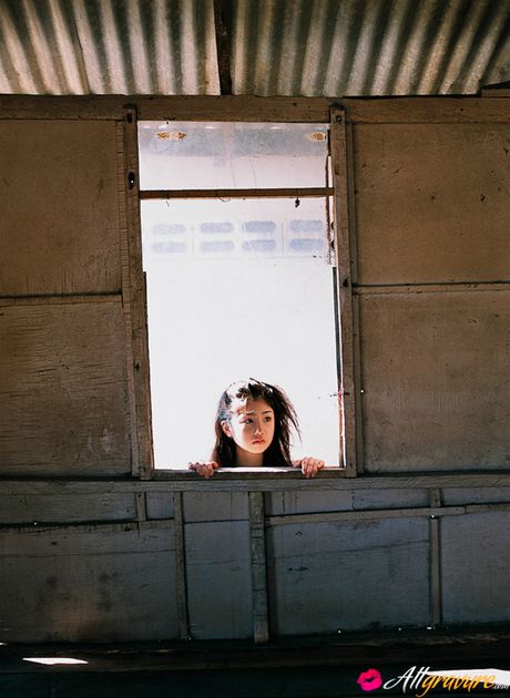 Hot Asian teen Yuko Ogura exhibits her small tits and poses in a solo