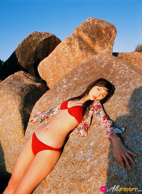 Hot Asian teen Yuko Ogura exhibits her small tits and poses in a solo