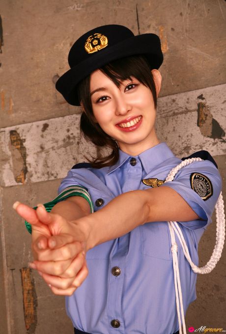 Asian policewoman Rina Akiyama strips to her uniform and shows her tits