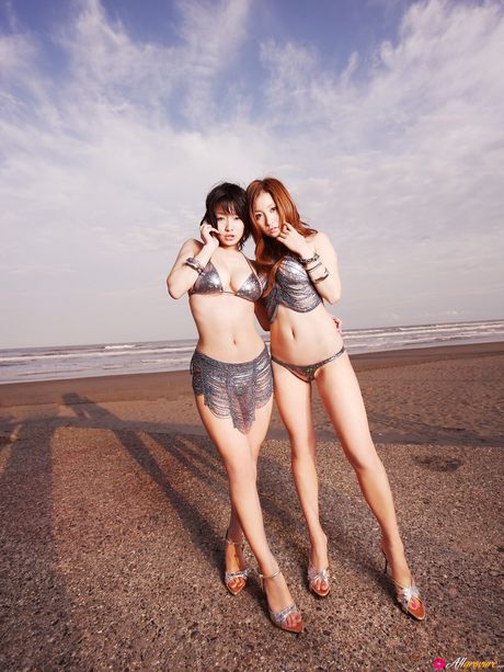 Asian lesbians Aya Kiguchi and Yuki Hana doff bikinis on a balcony