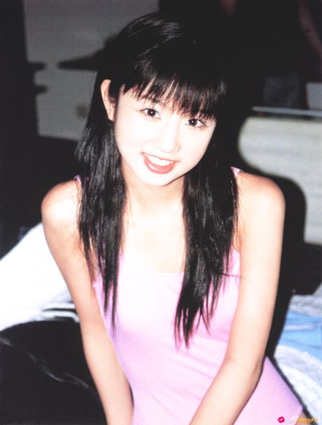 Asian girl Yuko Ogura unveils her small tits and poses in a solo