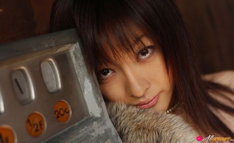 Asian stunner Sakura Shiratori gets naked in a black dress and heels