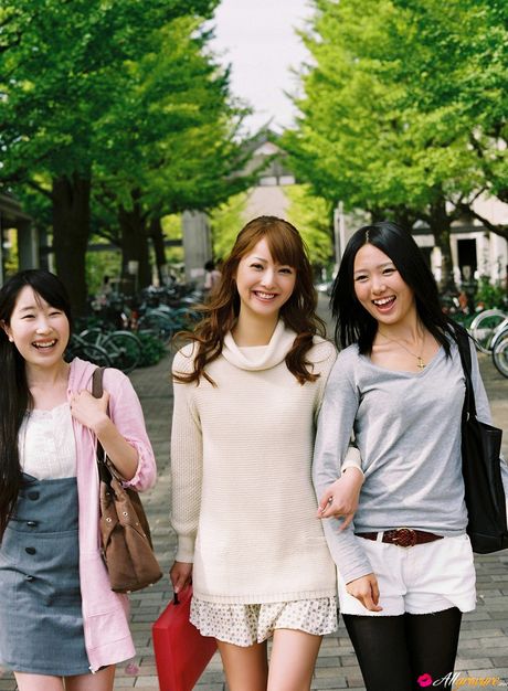 Asian teen Nozomi Sasaki gets naked on a sofa in a cheerleader uniform