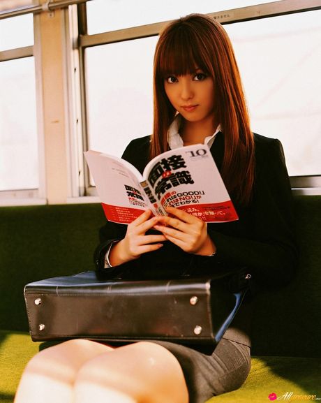 Asian teen Nozomi Sasaki gets naked on a sofa in a cheerleader uniform