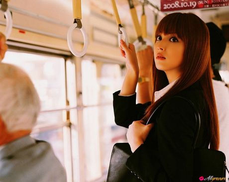 Asian teen Nozomi Sasaki gets naked on a sofa in a cheerleader uniform