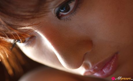 Asian teen Sakura Shiratori gets naked on a bed before a finger fuck