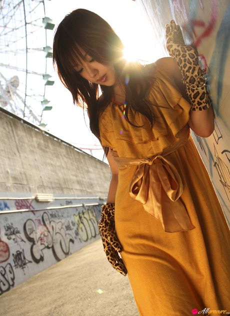 Asian covergirl Nao Yoshizaki removes her dress and demonstrates her hot body