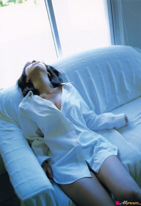 Asian teen Kasumi Nakane gets naked on a chair in a black dress