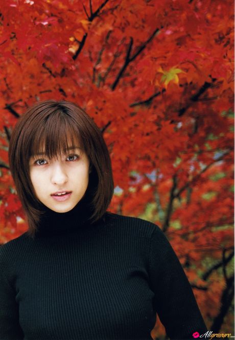 Asian teen Kasumi Nakane gets naked on a chair in a black dress