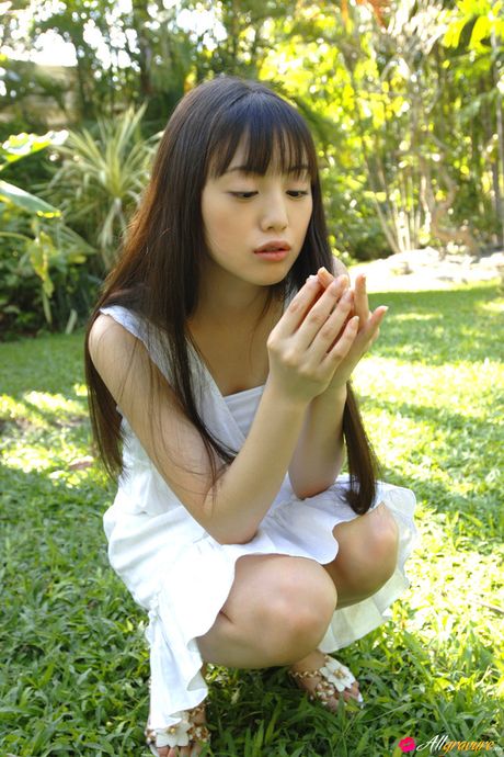 Hot Asian babe Miyuu Sawai posing in her bikini on the beach